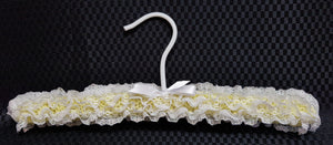 Child's knitted lace coathanger
