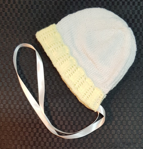 Hand Knitted Baby Bonnet. Lemon and White